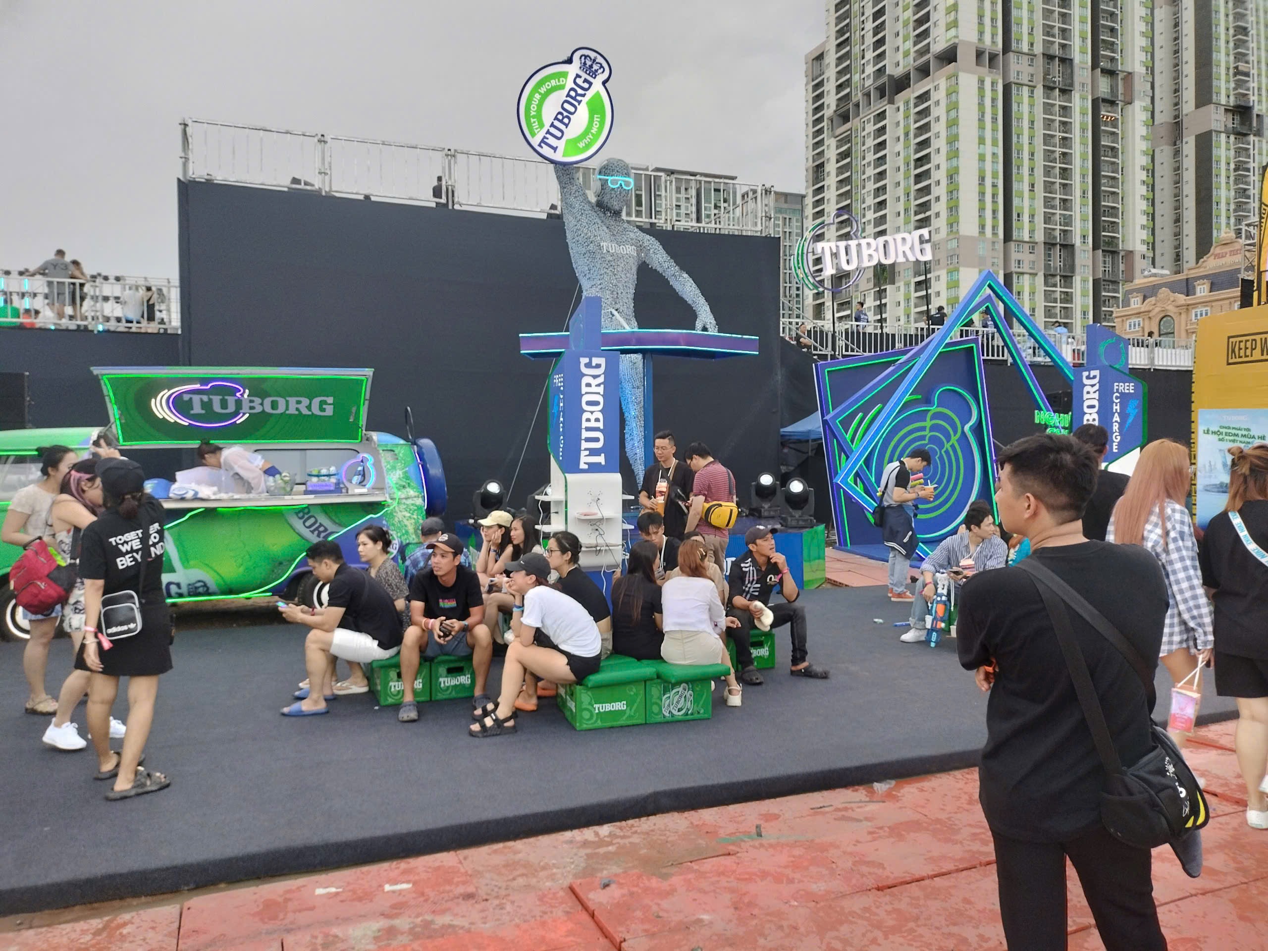 Busy outdoor Tuborg brand activation with crowds interacting