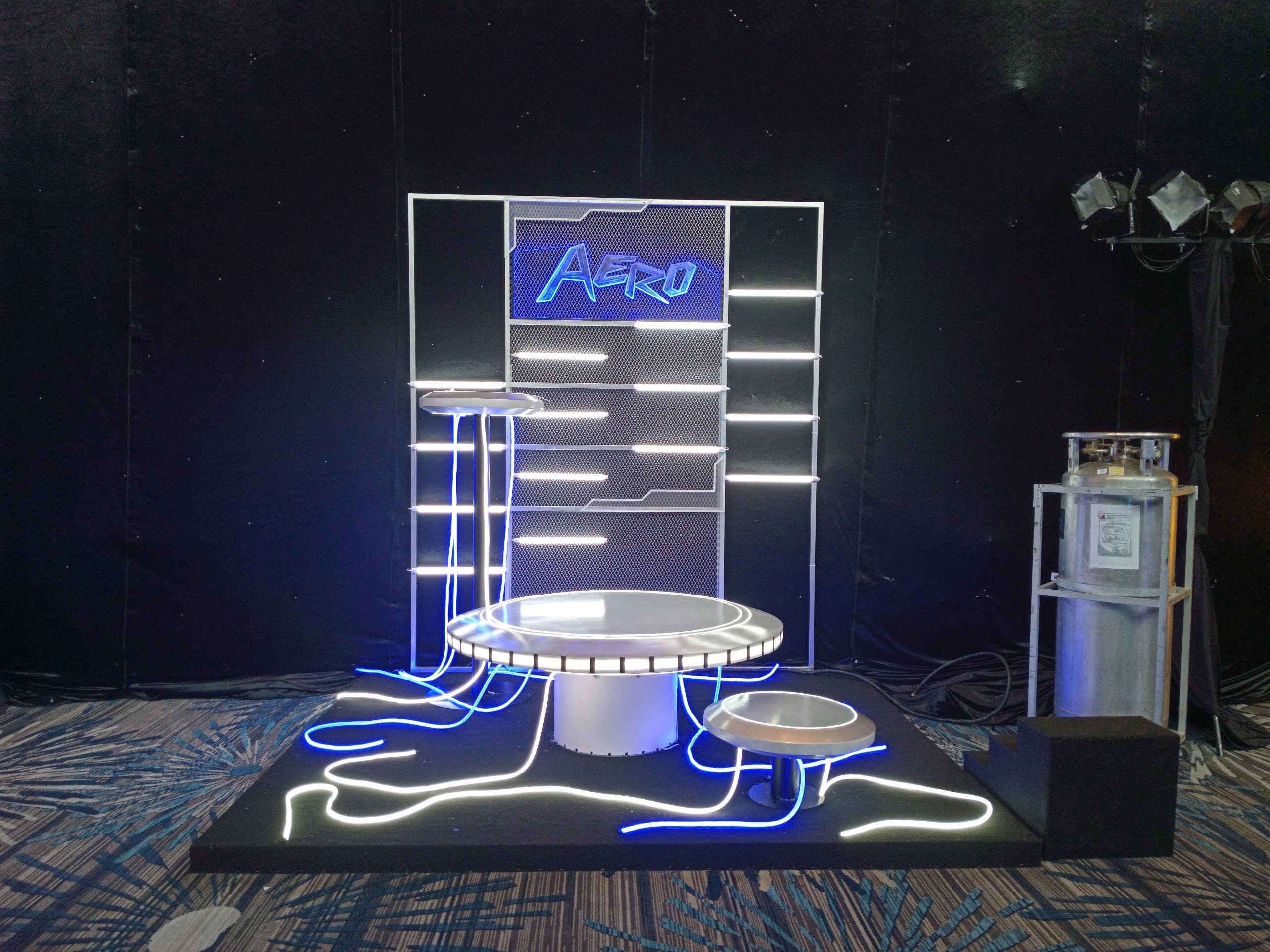 Glowing futuristic event installation with blue light accents